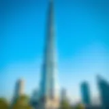 Stunning view of Al Aneeqa Tower against a clear blue sky